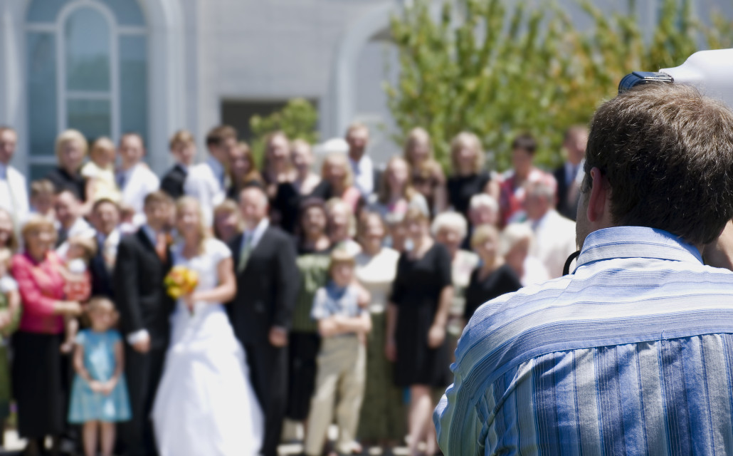 A family poses for a photo at a wedding.