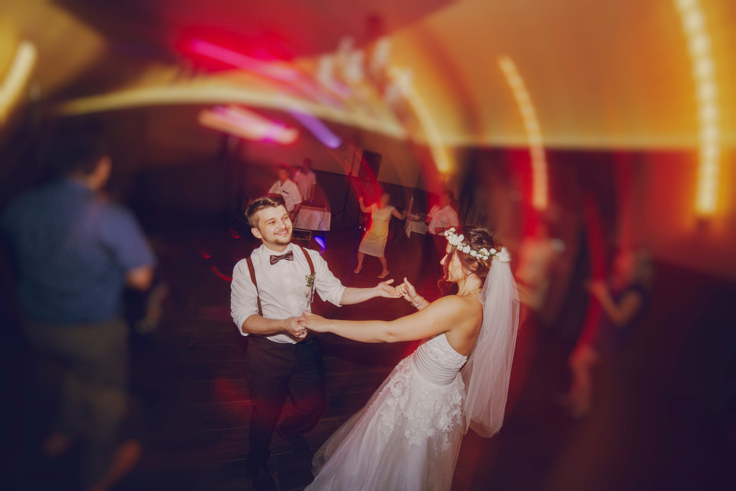 A couple dancing at their wedding.