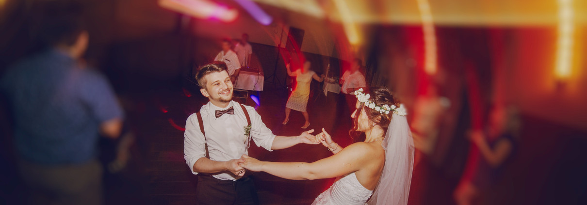 A couple dancing at their wedding.