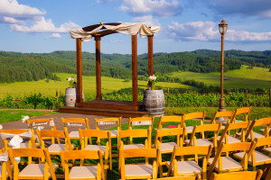 An altar and chairs set up for an outside summer wedding.