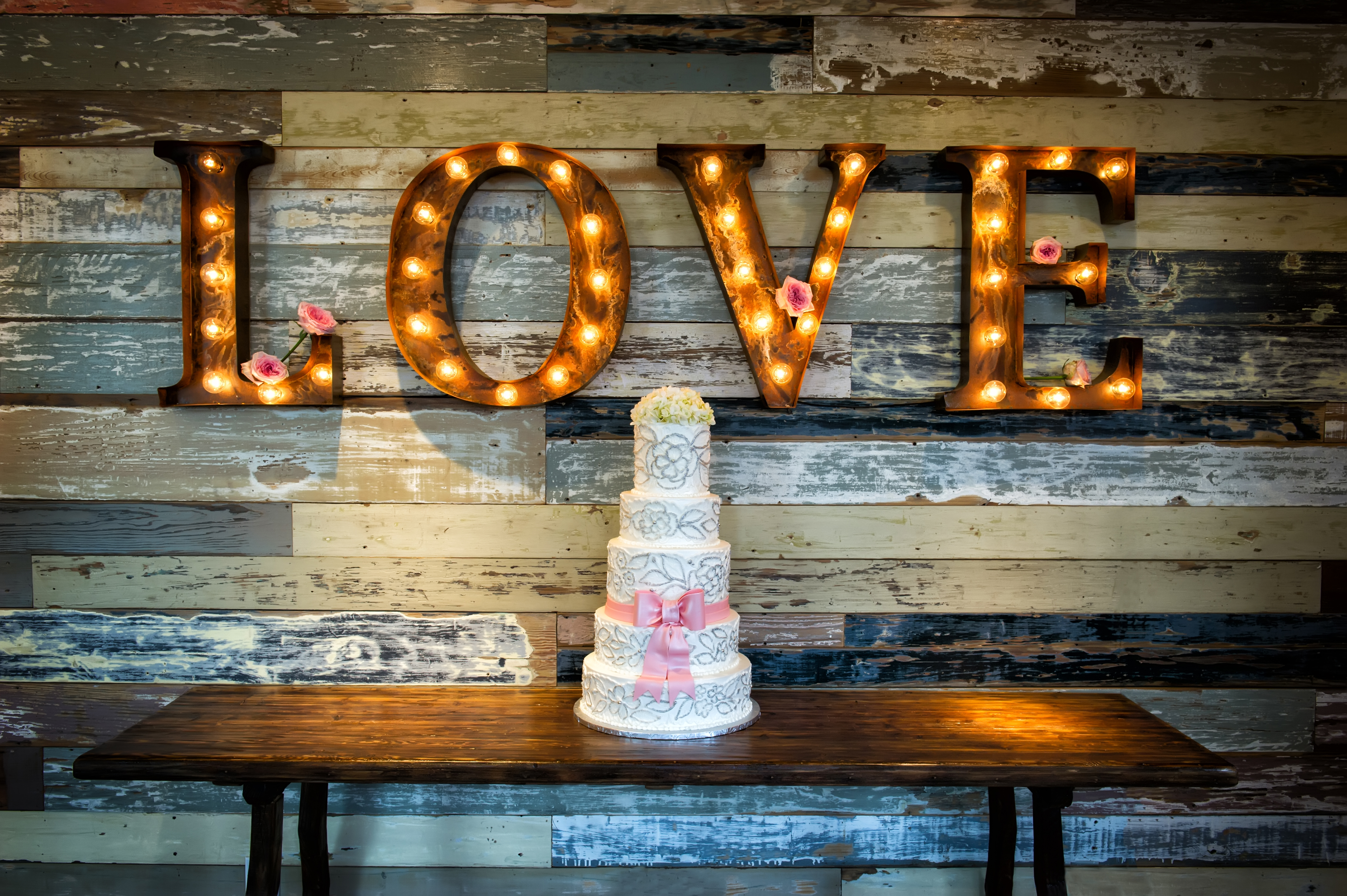 An example of gobo lighting, with the lights shining through the word "love". 