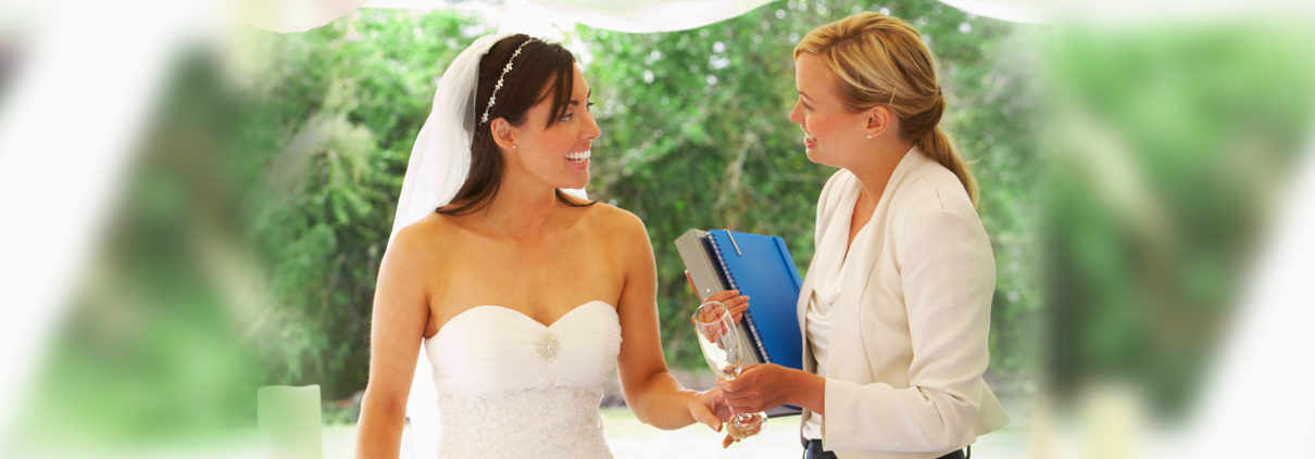 Smiling Bride with Wedding Coordinator at her side