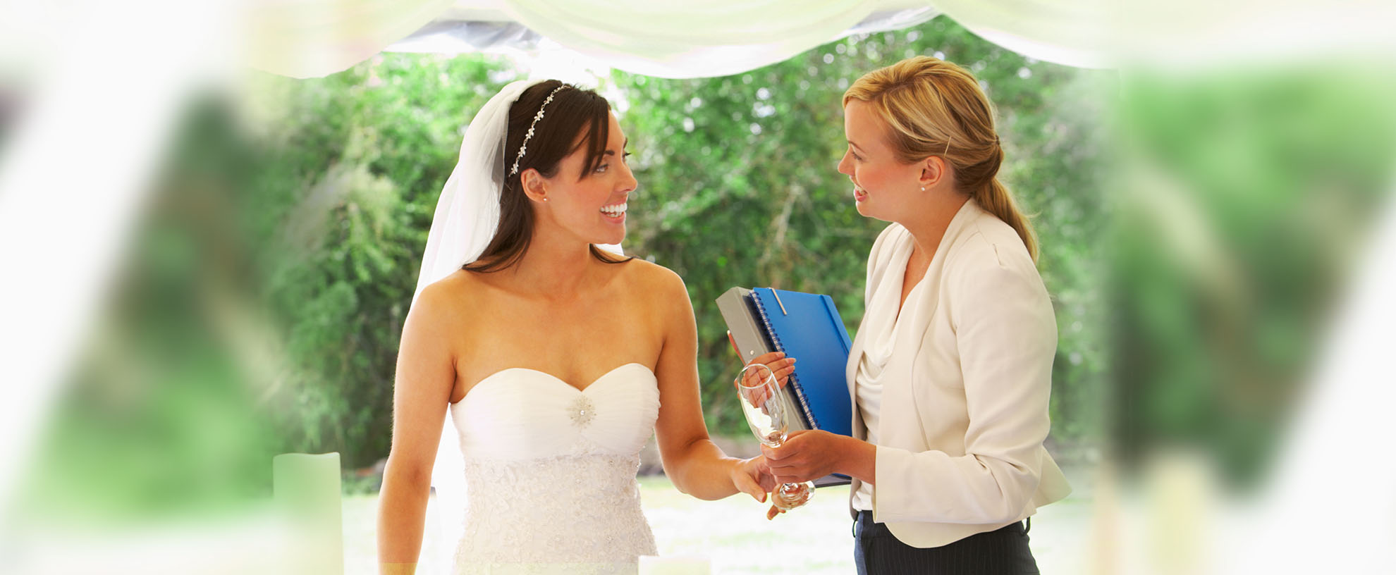 Smiling Bride with Wedding Coordinator at her side